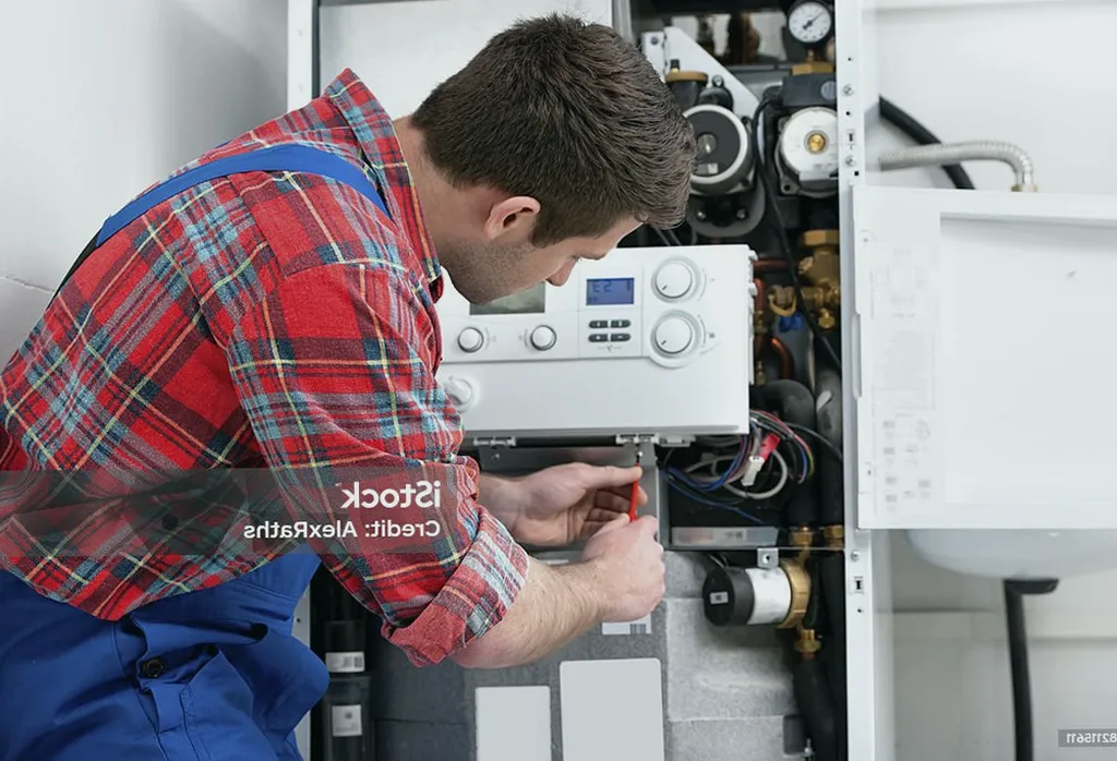 Técnico preparando materiales de calefacción en Castro de Rei